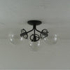 Glass Globe Tripod Flush Mount Light - Pepe & Carols